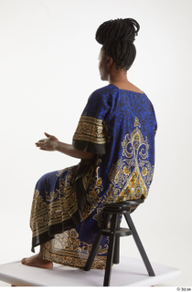 Dina Moses  1 dressed sitting traditional decora long african…